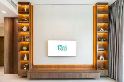 a room with a framed picture on a wall at FAM Living - 2BR Apartment with Burj & Canal Views at The Bay in Dubai