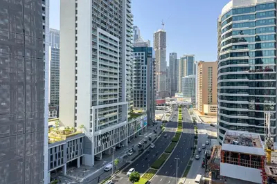 an aerial view of a city with tall buildings at Stylish 1B in J one With Balcony & Canal View in Dubai