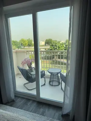 a view of a balcony with a table and a table at Luxury 4 Bedroom Villa The Springs Dubai in Dubai