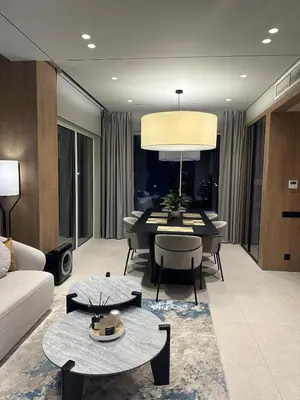 a living room with a couch and a table at Luxury 4 Bedroom Villa The Springs Dubai in Dubai