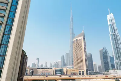a view of a city skyline with tall buildings at Luxury2BR BurjKhalifa View Infinity Pool Mall Walk in Dubai