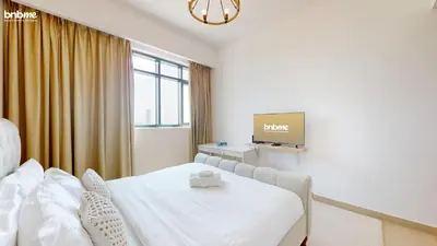 a hospital room with a bed and a tv at bnbmehomes - Vida Residence A1 in Dubai