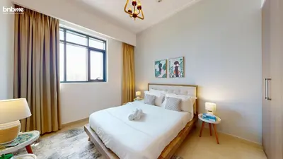 a bedroom with a bed with a teddy bear on it at bnbmehomes - Vida Residence A1 in Dubai
