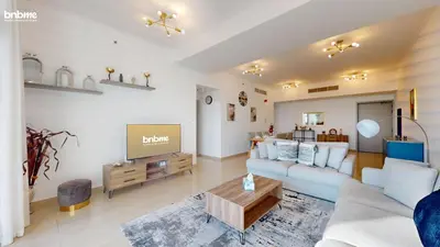 a living room with a couch and a tv at bnbmehomes - DEC Tower 1 in Dubai