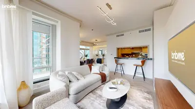 a living room with a couch and a table at bnbmehomes - The Lofts Central in Dubai