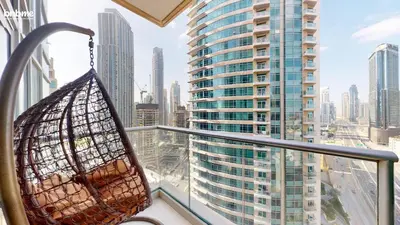 a basket on a balcony with a view of a city at bnbmehomes - The Lofts Central in Dubai