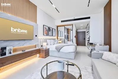 a hotel room with a bed and a tv at bnbmehomes - Trillionaire Residences By Binghatti in Dubai