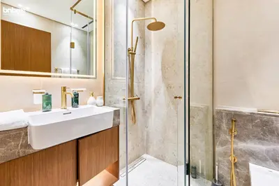 a bathroom with a sink and a shower at bnbmehomes - Trillionaire Residences By Binghatti in Dubai