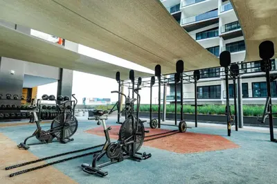 a group of exercise bikes in a building at 2 Bedroom Apartment in Business Bay Gym, Pool & View in Dubai