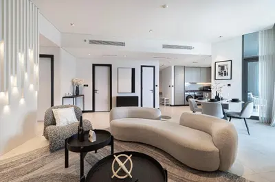 a living room with a couch and chairs and a table at 2 Bedroom Apartment in Business Bay Gym, Pool & View in Dubai
