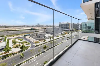 a view of a highway from the balcony of a building at 1BR Azizi Riviera 44 City Skyline View in Dubai