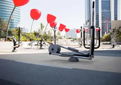 a playground with red balloons in a city at Stylish Stay, Walk to Dubai Mall, Downtown in Dubai