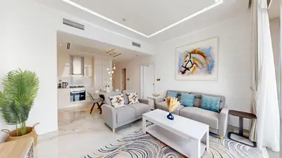 a living room with a couch and a table at Marina Gate 2 - High Rise One Bed with Marina View in Dubai