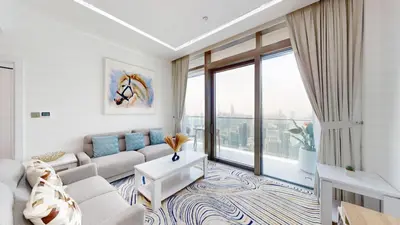 a living room with a couch and a large window at Marina Gate 2 - High Rise One Bed with Marina View in Dubai