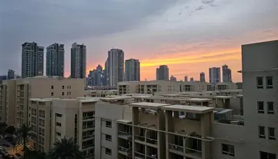a view of a city skyline with tall buildings at Urban Sunset, Newly Renovated Central 1BR in Dubai