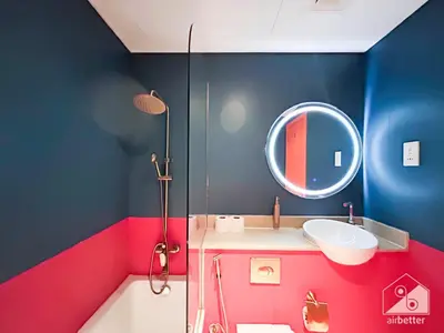 a bathroom with a sink and a mirror at Colorful Studio with Balcony & City Views in Dubai
