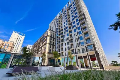 a large apartment building with windows on a clear day at Walk to Dubai Hills Mall, Premium Amenities And Near Dubai Hills Park And Golf Club, Socio Tower 1, Dubai Hills by Deluxe Holiday Homes in Dubai