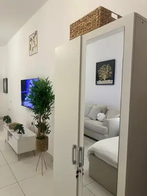 a living room with a bed and a couch at Luxury studio with full sea view in Dubai