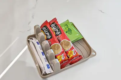 a suitcase filled with different types of snacks at Golden Stays - Private Pool in Binghatti Onyx I Modern 2BR Apartment I JVC Dubai in Dubai