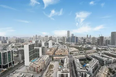 an aerial view of a city with tall buildings at Golden Stays - Private Pool in Binghatti Onyx I Modern 2BR Apartment I JVC Dubai in Dubai