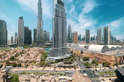 a view of a city with tall buildings at Burj Khalifa & Fountain Balcony Views, Pool & Gym in Dubai