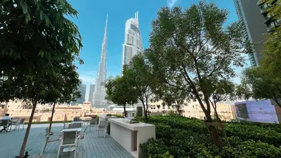 a view of a city skyline with tall buildings at Burj Khalifa & Fountain Balcony Views, Pool & Gym in Dubai