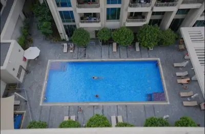 an overhead view of a swimming pool in a building at Burj View 1BR Pool,Gym,Sauna,Dubai Mall in Dubai