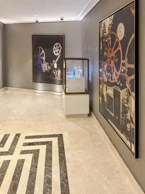 a room with paintings and a exhibit on the wall at Famous Infinity Pool with Burj Khalifa View on High Floor in Dubai