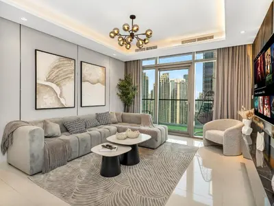 a living room with a couch and a table at Famous Infinity Pool with Burj Khalifa View on High Floor in Dubai