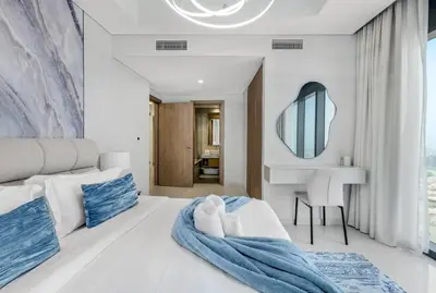 a bedroom with a white bed and a mirror at Guest Favorite - Premium 3BR with Skyline Views at Floor 50 in Dubai