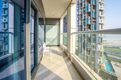 a balcony in a building with large windows at Paramount Tower 1 BR, Hollywood Style Stay in Dubai