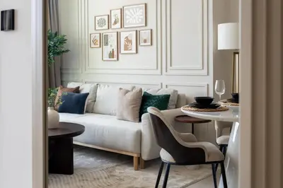 a living room with a couch and a table at GuestReady - New Gem | JVC | Binghatti Gardenia in Dubai