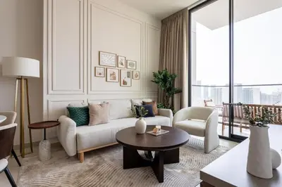 a living room with a couch and a table at GuestReady - New Gem | JVC | Binghatti Gardenia in Dubai