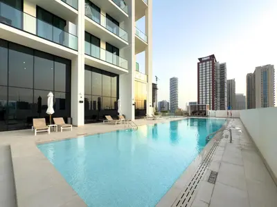 a swimming pool on the roof of a building at GuestReady - New Gem | JVC | Binghatti Gardenia in Dubai