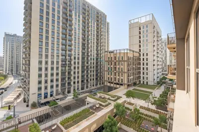 an aerial view of a city with tall buildings at Steps from Dubai Hills Mall, Surrounded by Top-Tier Amenities, and close to Dubai Hills Park and Golf Club, Socio Tower 1, Dubai Hills by Deluxe Holiday Homes in Dubai