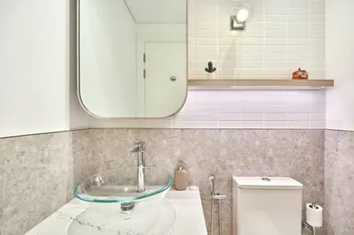 a bathroom with a sink and a mirror at Premium 2BR with Pool, Gym & Lifestyle Amenities in Dubai