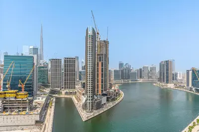 a view of a city with a river and buildings at Upmarket - 1BR - Canal View - 9 MIN Dubai Mall in Dubai