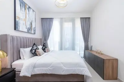 a bedroom with a white bed with a window at Guest Favorite - Modern and Upgraded 2BR Heart of Downtown in Dubai