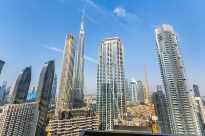 a view of a large city with tall buildings at Guest Favorite - Luxury 2BR with Full Burj Khalifa View Downtown in Dubai