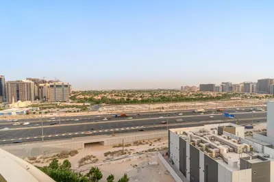 an aerial view of a highway in a city at FIRST CLASS 1BR Stylish Vibe in Dubai