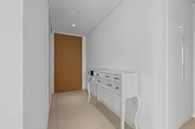 a white kitchen with a stove and a sink at Bluewater Residence 6- Spacious Outlet in Dubai