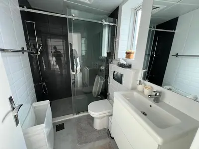 a bathroom with a sink and a toilet and a shower at Italian-Style 2BR - Near Beach, Metro and Mall in Dubai