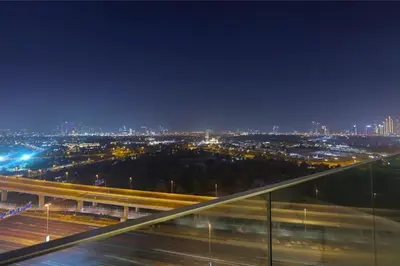 a view of a city at night with traffic at 1 Residences High-Floor Apt with City View, Al Kifaf in Dubai