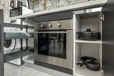 a kitchen with an oven and a sink at stylish 1BR Pearlz Pool & Gym Near Metro in Dubai