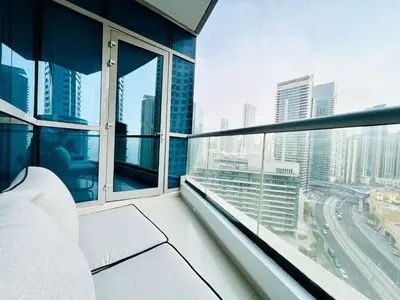 a balcony with a view of a city at Opposite JBR Beach - Modern Studio in Dubai