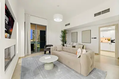 a living room with a couch and a table at Luxury 5BR Penthouse in Marina l Private Jacuzzi & Sauna in Dubai