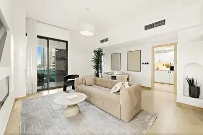 a living room with a couch and a table at Luxury 5BR Penthouse in Marina l Private Jacuzzi & Sauna in Dubai
