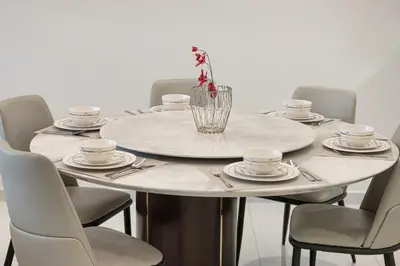 a table with plates and cups and a vase on it at Luxury 2BR with Burj Khalifa View l High Floor at Paramount in Dubai