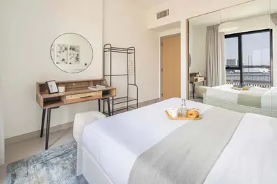 a hotel room with a bed and a mirror at Frank Porter - Hyati Avenue in Dubai