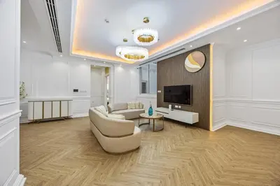 a living room with a couch and a tv at Luxury Villa with Pool, Cinema & Spa - Jumeirah Golf in Dubai